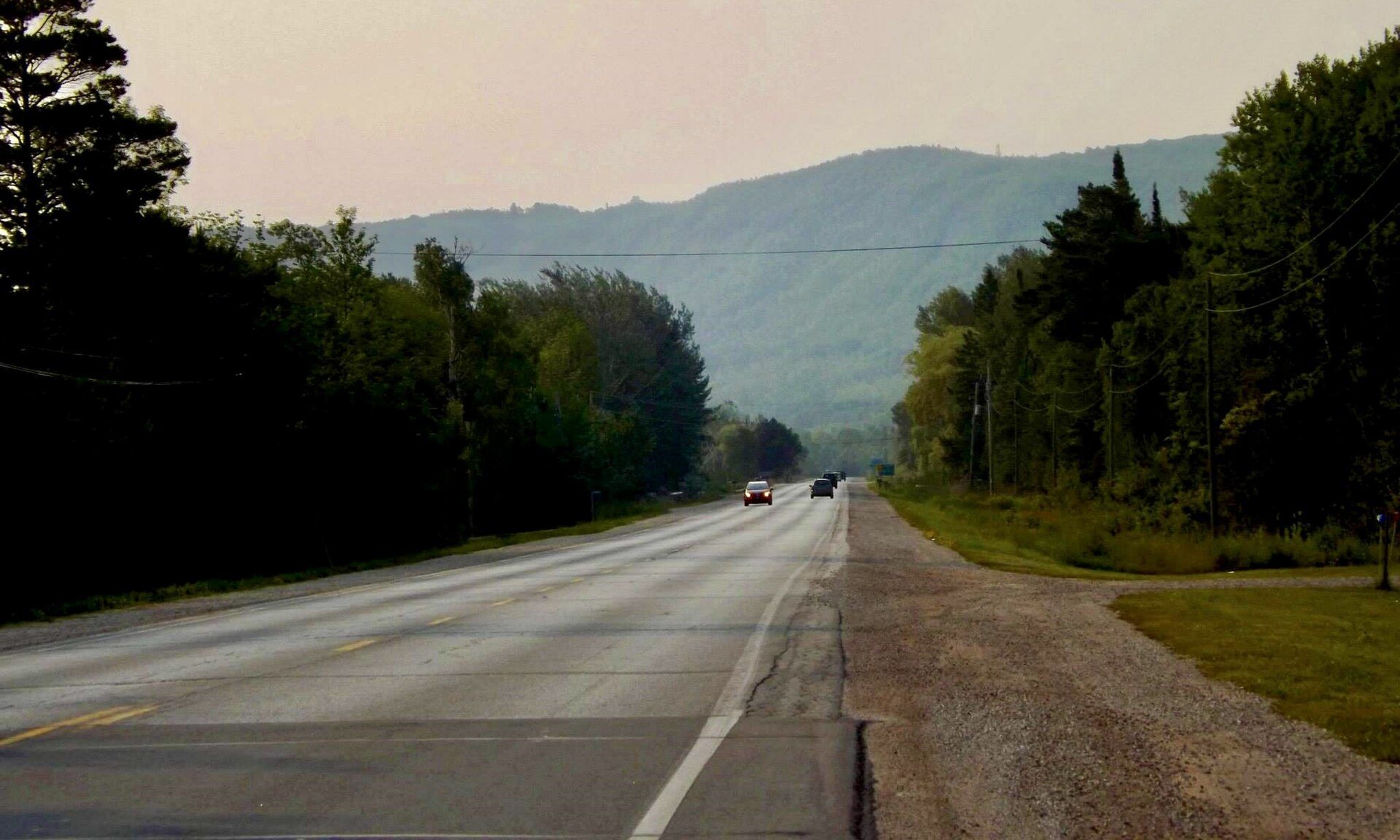 The Blue Mountains rising beyond farmland, seen looking east along Highway 26