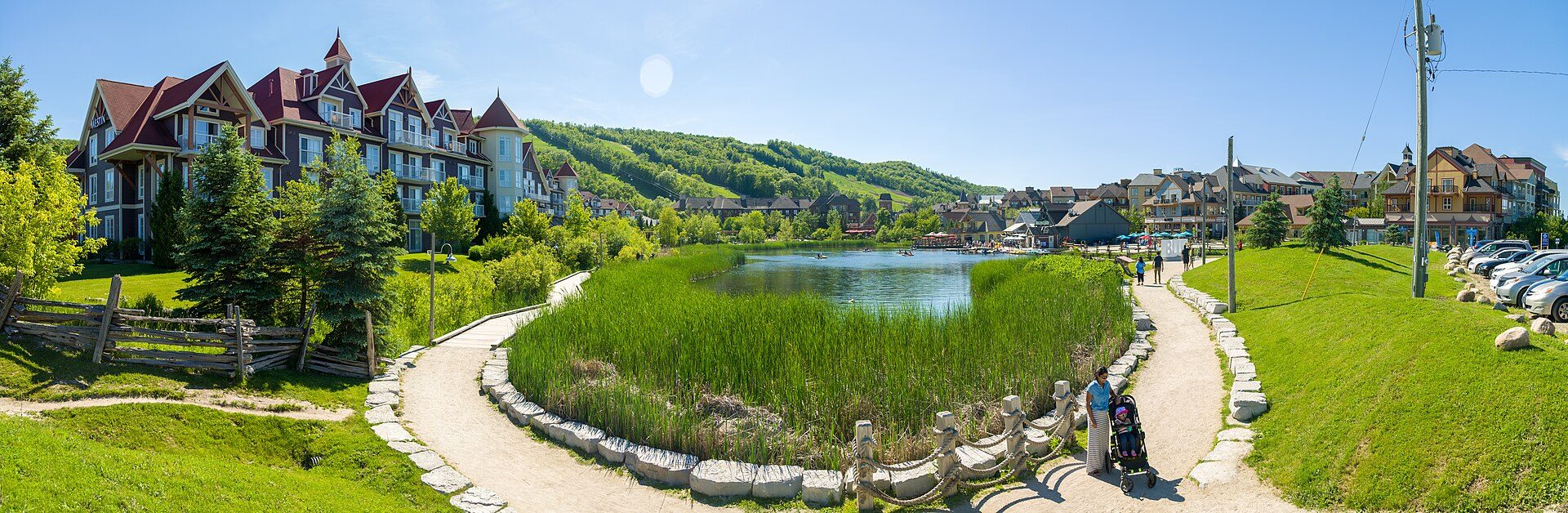 Wide panorama of Blue Mountain Resort in summer, the escarpment rising behind the village